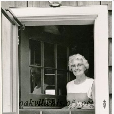 Mrs Elaine Poole looking out her front door, 213 King Street, 1972